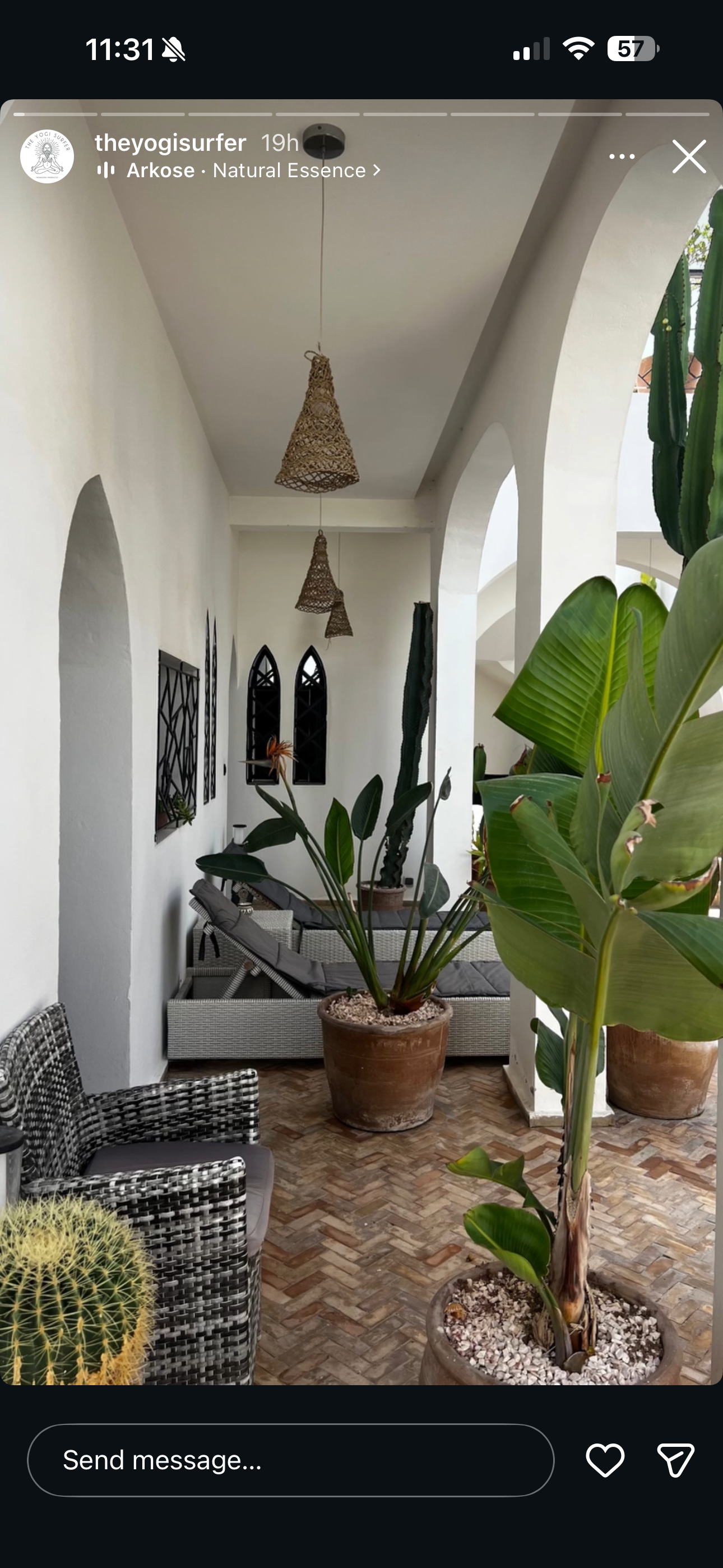 Villa Oura Spirit arched lounge with rattan pendants and tropical plants